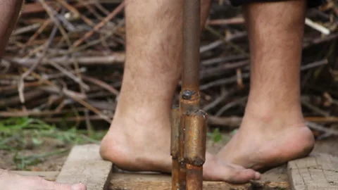 Technology. two men drilled a water well with an improvised drilling rig Stock Footage 107920465