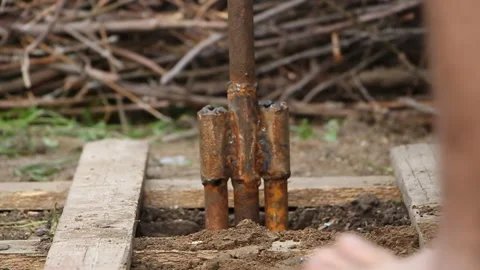 Technology. two men drilled a water well with an improvised drilling rig Stock Footage 107926607