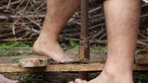 Technology. two men drilled a water well with an improvised drilling rig Stock Footage 107929392