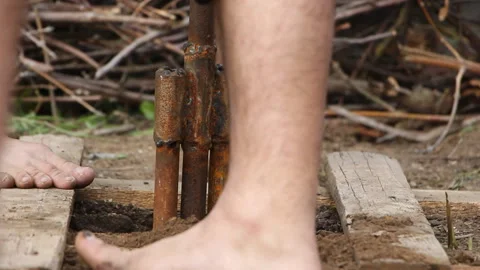 Technology. two men drilled a water well with an improvised drilling rig Stock Footage 108312889