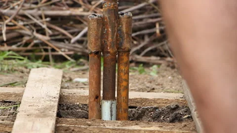 Technology. two men drilled a water well with an improvised drilling rig Stock Footage 108317702