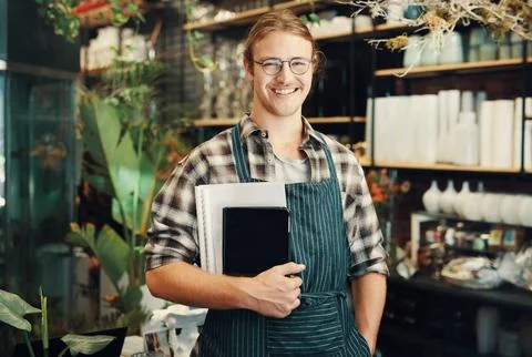 Technology will never replace paperwork. Cropped portrait of a handsome young Stock Photos