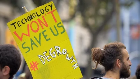 Technology wont save us. Degrowth. Poster at Global Climate Strike. Young People Video stock 116799031
