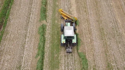 Tedder machinery in action on the ground Stock-Footage 163468458