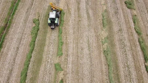 Tedder machinery in action on the ground Video stock 163468915