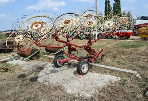 Tedder on trailer for tractor. The machine for gathering hay. Stock Photos