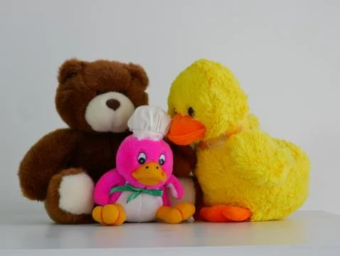 Teddy bear and two ducks Stock Photos