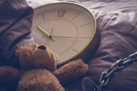 Teddy bear on the bed Stock Photos