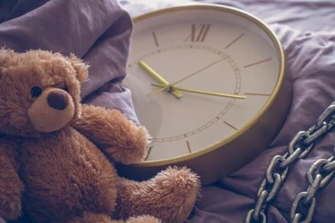 Teddy bear on the bed Stock Photos