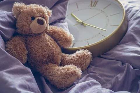 Teddy bear on the bed Stock Photos