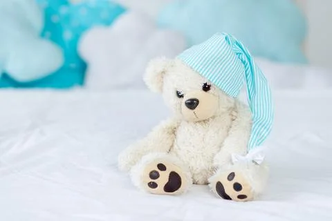 Teddy bear on the bed for sleeping, the interior of the children's room, th.. Photos