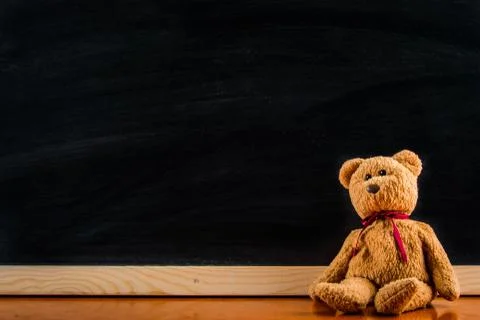 Teddy bear with blackboard , background Stock Photos