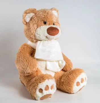 Teddy bear with a bow on a white background. Soft children's toy. Foto stock