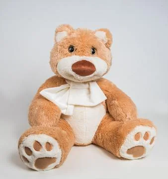 Teddy bear with a bow on a white background. Soft children's toy. Foto stock