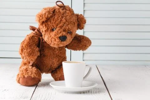 Teddy bear with cup of coffee Stock-Fotos