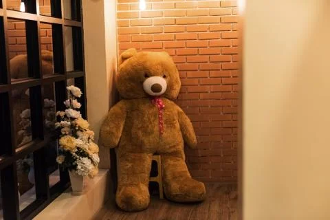 Teddy bear doll at brick wall Stock Photos