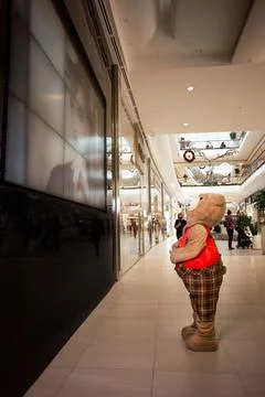 Teddy bear on the escalator at the mall Stock Photos