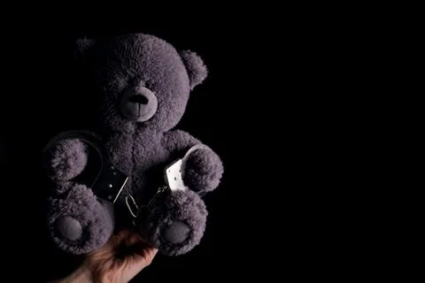 Teddy bear in handcuff Stock Photos