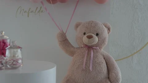 Teddy Bear Holding Pink Balloons Beside A Candy Table At A Christening Stock Footage 343704070