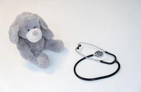 Teddy bear, isolated on white background, with a stethoscope. Фото