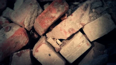 Teddy bear lies between bricks in war zone 스톡 동영상 68038218