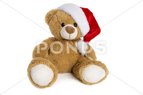 Teddy bear with Santa Claus hat isolated on white background Stock Photos