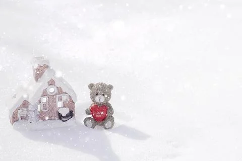 Teddy bear sitting in the snow Stock Photos