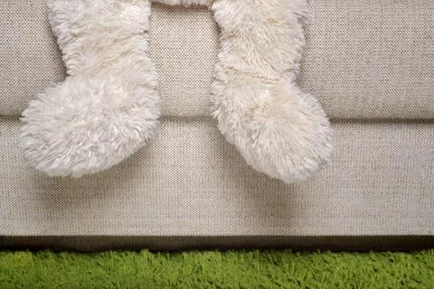 Teddy bear is sitting on the sofa Stock Photos