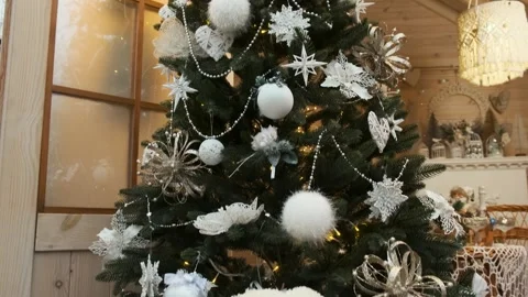 Teddy bear on a sleigh against the background of a decorated Christmas tree. Stock Footage 259486049