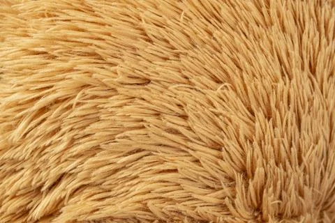 Teddy bear toy fluffy structure close up, brown abstract backdrop texture Stock Photos