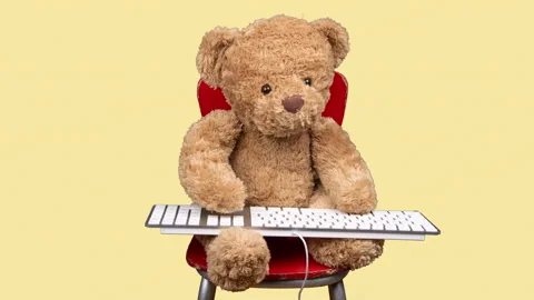 Teddy bear typing on keyboard Stock Video Pond5