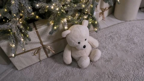 Teddy bear under Christmas tree with gentle camera movement Stock Footage 323224205