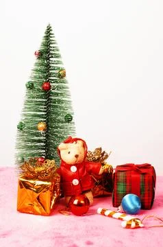 Teddy dol and gift box with christmas tree decoration backgrounds Stock Photos