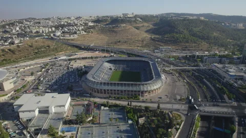 Teddy Stadium’s Jerusalem, israel empty grandeur in this high-altitude parallax Stock-Footage 317842230