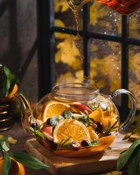 Tee with orange, Ginger, Lemon, Mint and rosemary on wooden board Fotos de archivo
