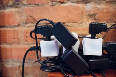 Tee in socket. macro Device adapter tee electrical on three sockets Stock Photos