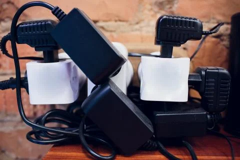 Tee in socket. macro Device adapter tee electrical on three sockets Stock Photos
