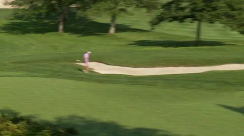 Teeing up on the greens (3 of 6) Stock Footage 32716742