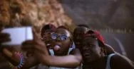 Teen African American Girl Taking Selfie Of Herself And Friends Stock Footage