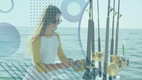 Teen angler reaching rod turning reel checking drag preparing tackle on boat Vídeos de archivo 334703353