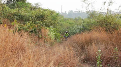 Teen Boy Biking Uphill Stock Footage 59305666