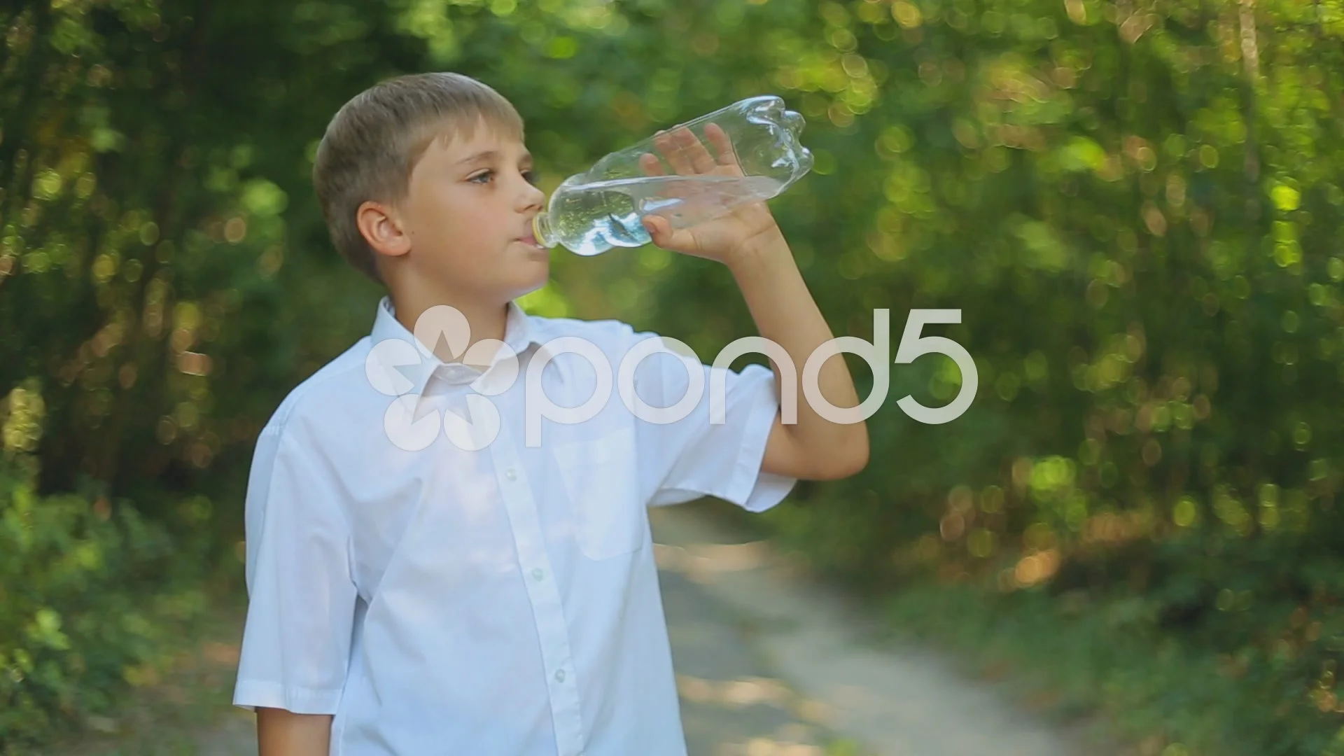 https://images.pond5.com/teen-boy-drinks-water-bottle-footage-043851549_prevstill.jpeg