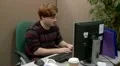 Teen boy getting angry with computer in office HD Footage