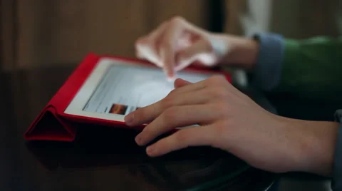 Teen boy hands using a tablet computer, browsing applications Stock Footage 36328709