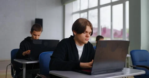 Teen Boy Learning Programming Language In Coding Classes In High School, Exam Stock Footage 280176535
