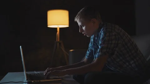 Teen Boy Playing Computer Video Game At Home Stock Footage 121935011