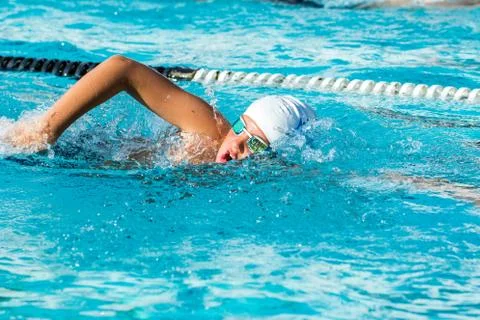 Teen boy at swimming practice. Stock Photos