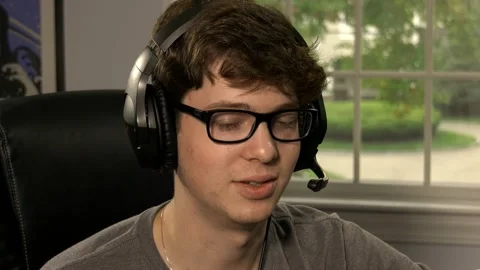 Teen boy talking on headset Stock Footage 140477261