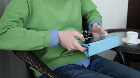 Teen boy using a tablet computer on a terrace, student working outdoors Stock Footage 36329680