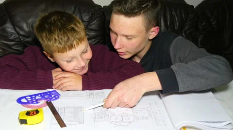 Teen Explaining Architectural Plan To His Brother Video stock 42954615